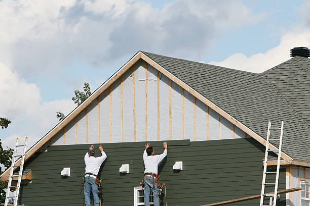 Professional Storm Damage Siding Repair technician working in Huntington, IN